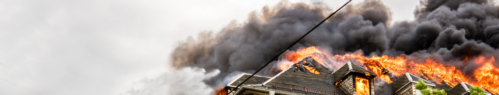 preventing home fire losses, banner image of house on fire